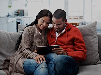 young couple using a tablet
